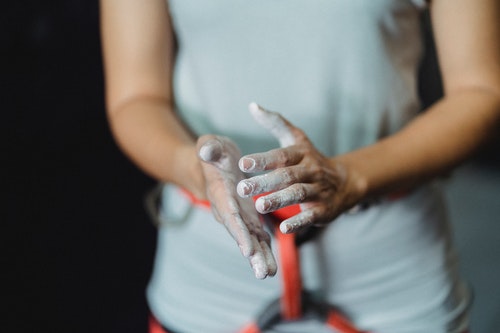 Sportswoman with talc on hands