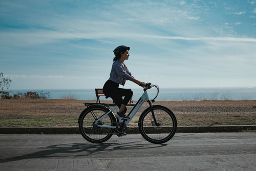 Woman Riding Bicycle On Road